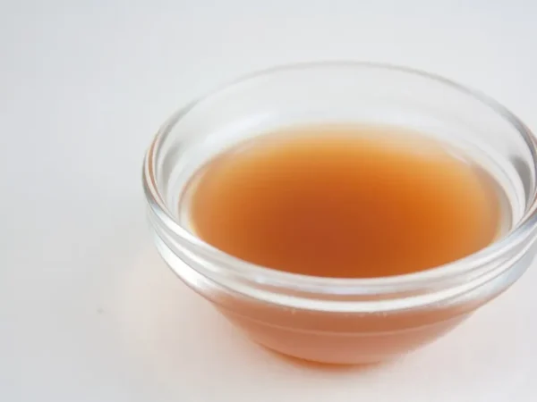 A small bowl of apple cider vinegar