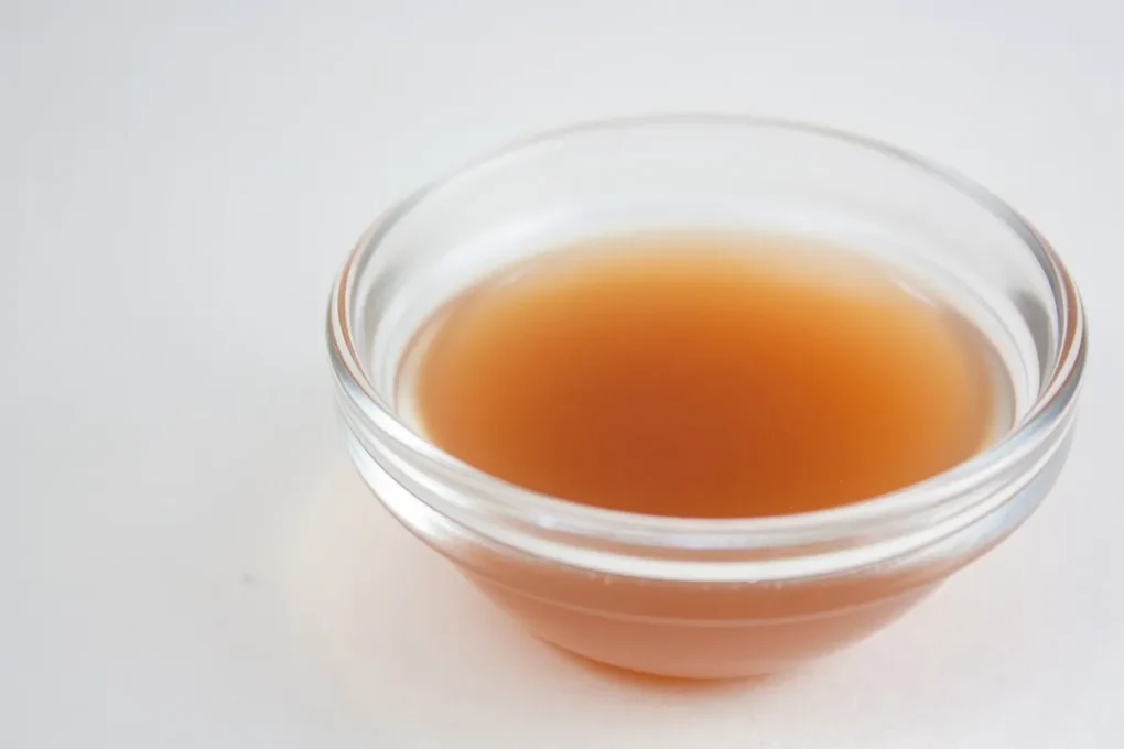 A small bowl of apple cider vinegar