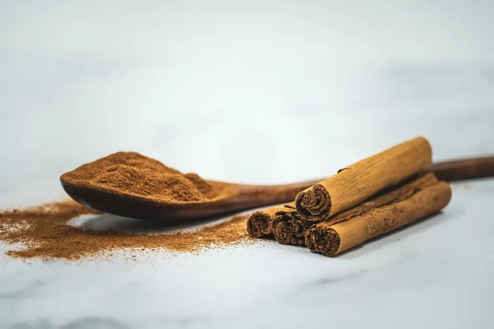 Foods and Spices Studied for Healthy Blood Sugar Levels 2 Healthy blood sugar: cinnamon sticks and ground cinnamon on a spoon
