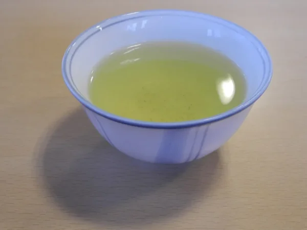 A bowl of brewed green tea