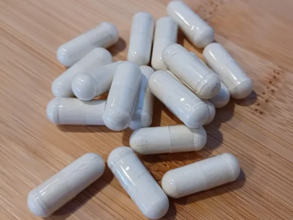 White dietary supplement capsules
